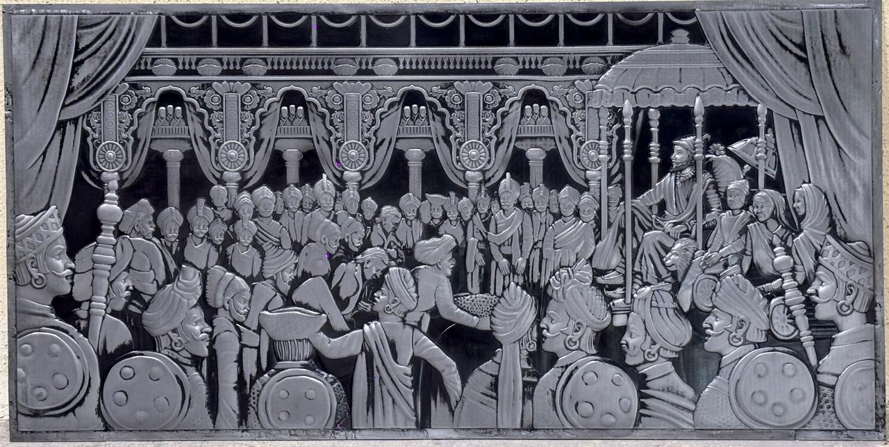 S3 monochrome relief mural showing a historical court scene